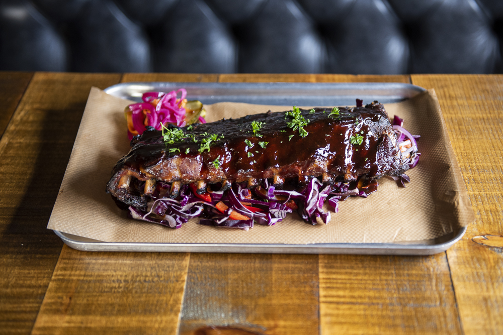Full rack of glazed BBQ ribs with slaw